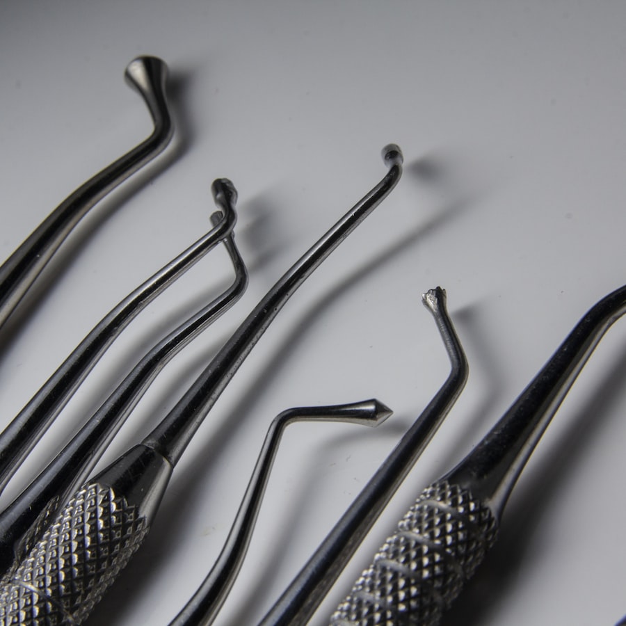 Dental instruments laid out on grey, photographed as still life